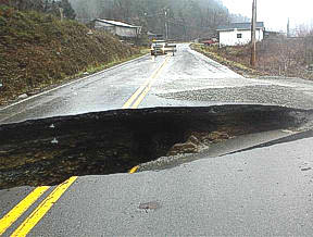 Water covering the road can create an impassable barrier.